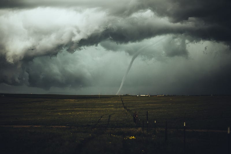 Tornado chaser documenting a storm