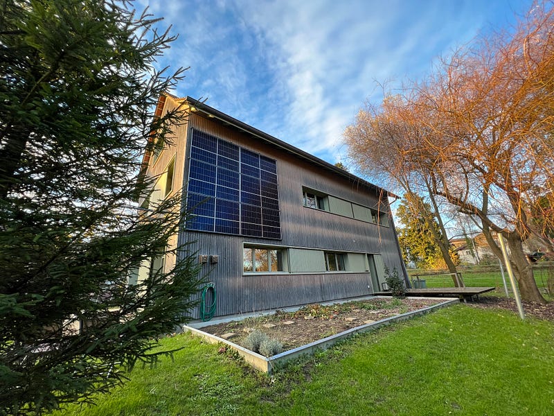 Vertical solar panels on the eastern facade of a home